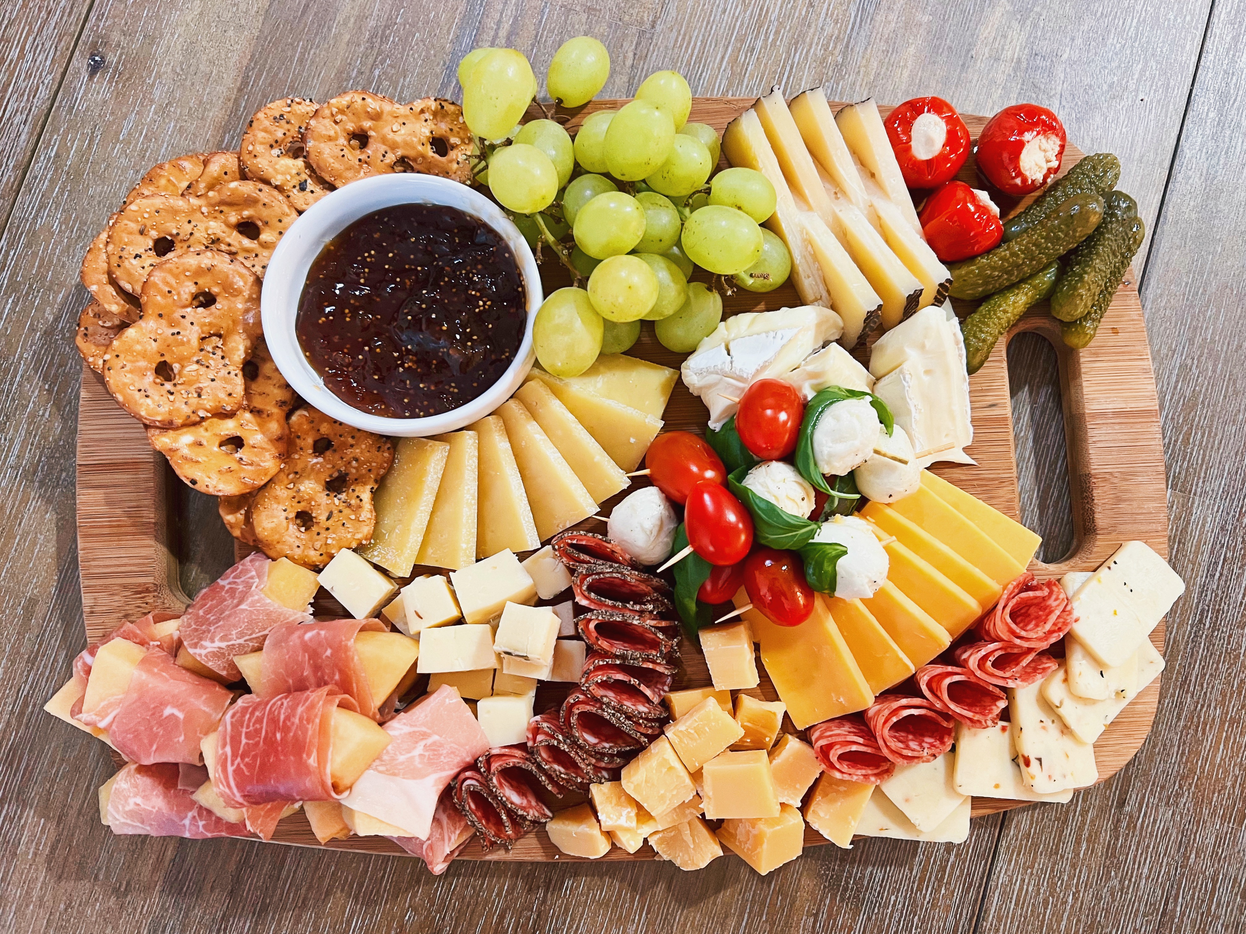 Rustic Wooden Board with Fig Jam and Artisan Cheese